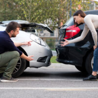 two people arguing about rear-end collision fault